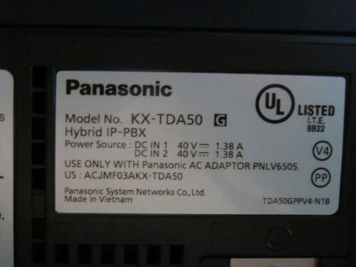 Back view of the Panasonic KX-TDA50 Hybrid IP-PBX Voicemail Processing System with power specifications and model number.