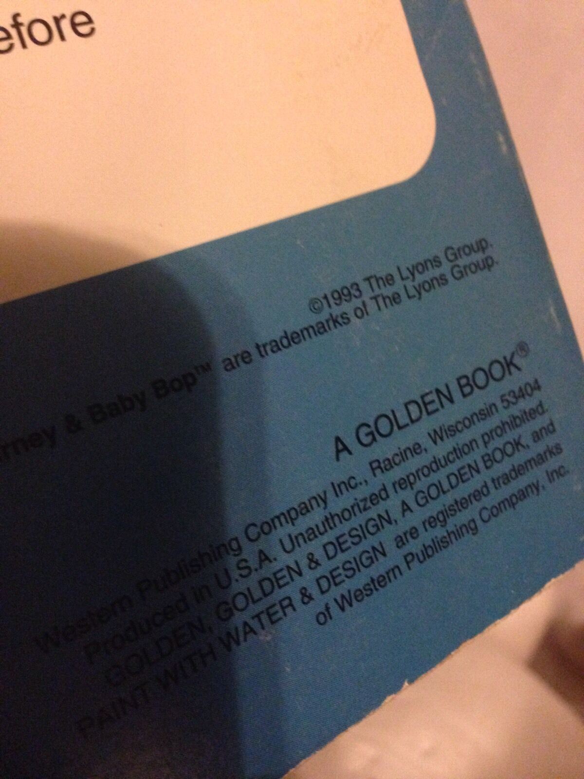 Close-up detail of the back cover of the Vintage 1993 Barney & Baby Bop Paint with Water Activity Book, showing the copyright notice and production details.