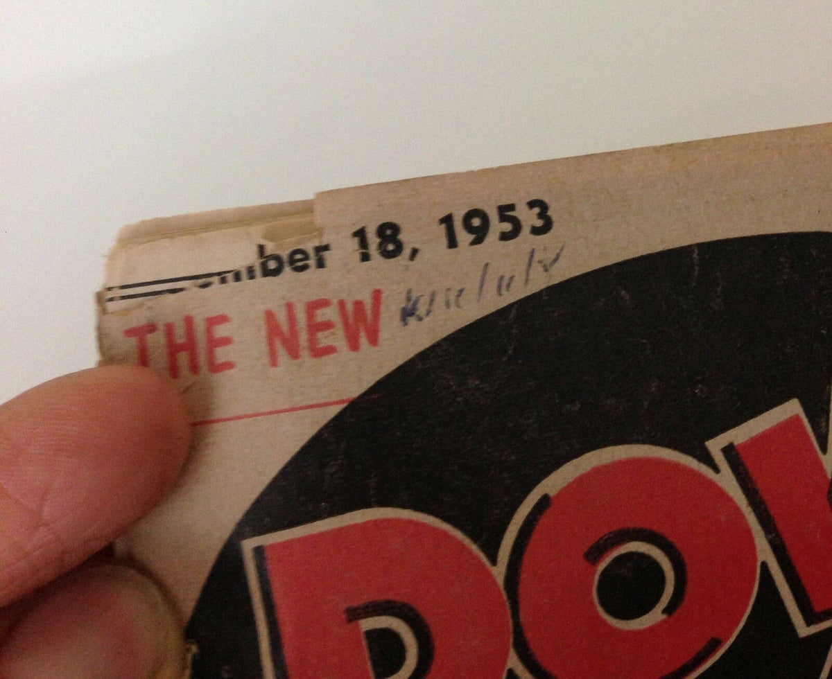 Top corner of Down Beat Magazine dated November 18, 1953, with the title and handwritten notes, featuring iconic artists like Guy Mitchell and Liberace.