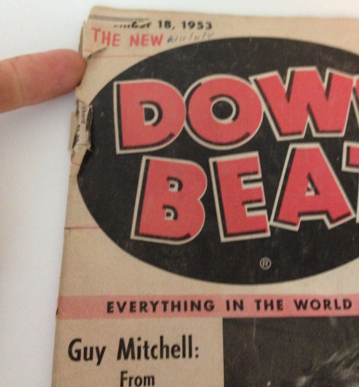 Part of the Down Beat Magazine cover showing the publication date, November 18, 1953, with a focus on Guy Mitchell's profile, capturing the essence of the music industry.