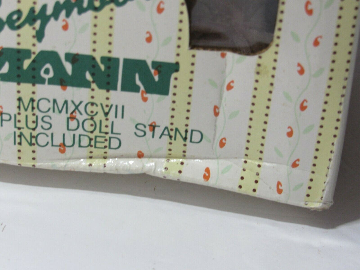 Close-up of the box for SEYMOUR MANN 'SALLY' Connoisseur Collection doll, showing a slight dent and decorative design.