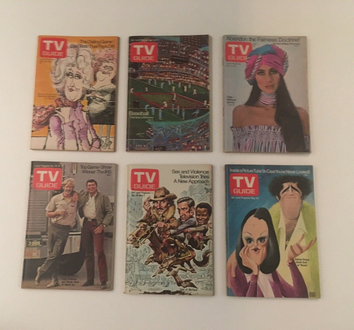 Complete Year of TV Guide Magazines 1975: An array of nostalgic TV Guide magazine covers representing memorable television events and personalities from 1975.