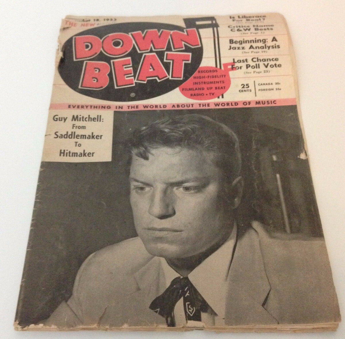 Another view of the cover of Down Beat Magazine from November 18, 1953, prominently featuring Guy Mitchell's name and related music topics.