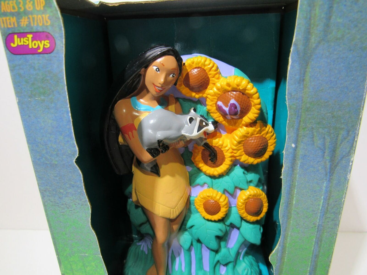 Close-up view of 1995 Disney Pocahontas Bank, showcasing Pocahontas and her raccoon friend Meeko with vibrant flowers, item #17015, by Just Toys.