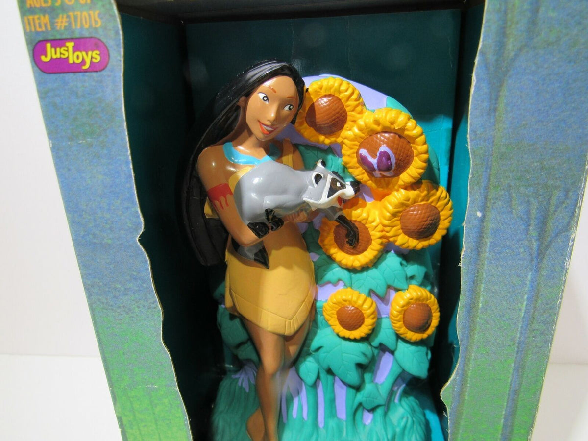 Side view of 1995 Disney Pocahontas Bank by Just Toys #17015, depicting Pocahontas lovingly holding Meeko against a backdrop of sunflowers.
