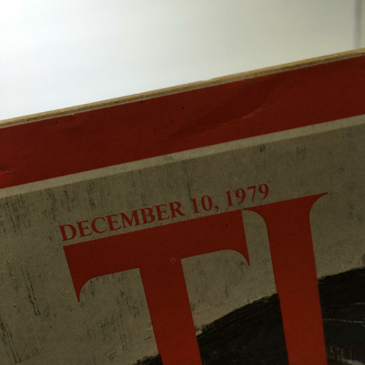 Close-up image of the date 'December 10, 1979' on the cover of Time Magazine featuring the issue 'Center of the Storm: Iran's Deposed Shah'.