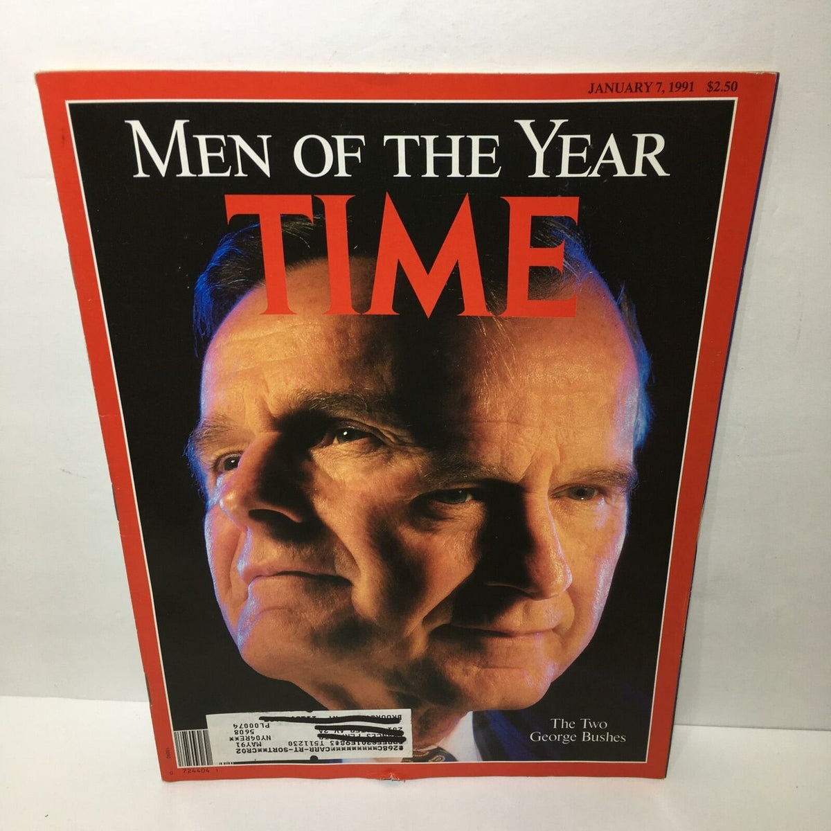 Cover of Time Magazine, January 7, 1991, featuring 'The Two George Bushes' as Men of the Year. The image showcases the faces of George H.W. Bush and George W. Bush in a prominent display.