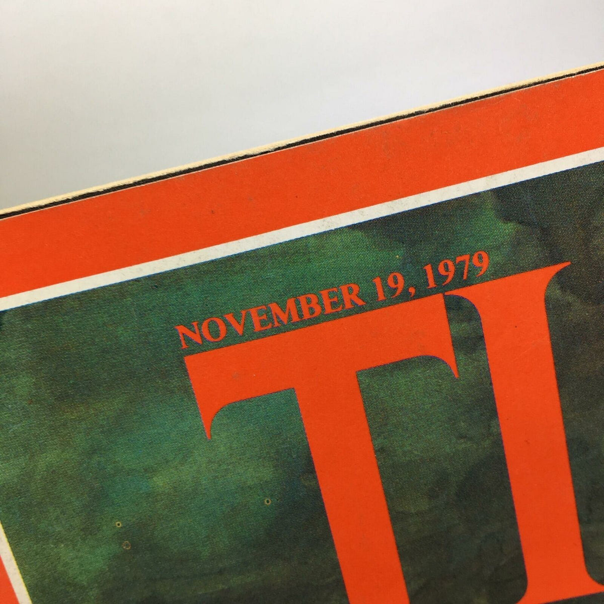 Close-up of the Time Magazine publication date, November 19, 1979, showcasing the iconic red and green design related to Ayatullah Khomeini.