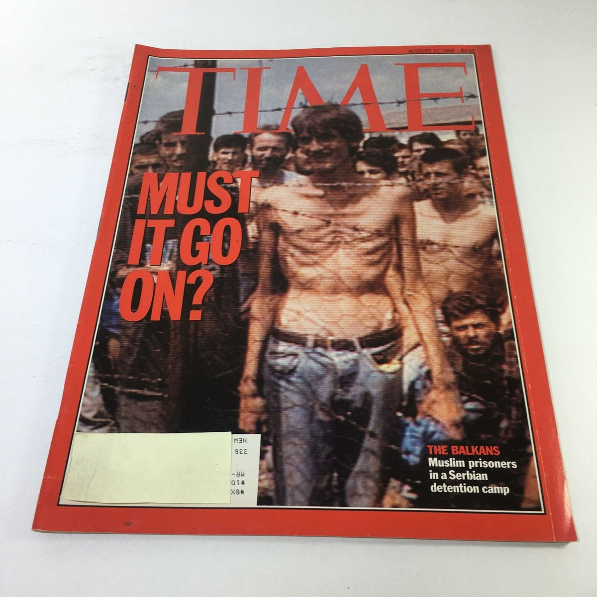 Cover of Time Magazine dated August 17, 1992, featuring the title 'Must It Go On?' with a poignant image related to Muslim prisoners in a Serbian detention camp. This vintage magazine highlights significant geopolitical issues and events in The Balkans.