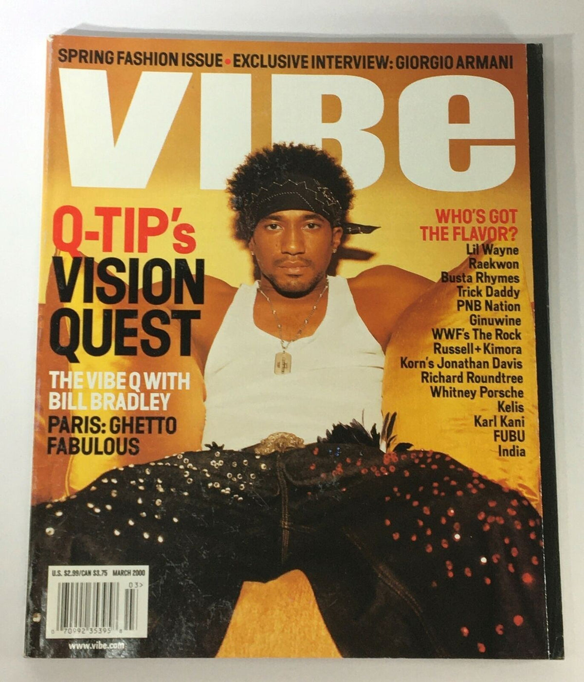 Vibe Magazine March 2000 cover featuring Q-Tip's Vision Quest with Bill Bradley, showcasing a fashionable Q-Tip dressed in a white tank top and embellished pants. This collectible vintage magazine highlights the intersection of hip-hop culture and politics.