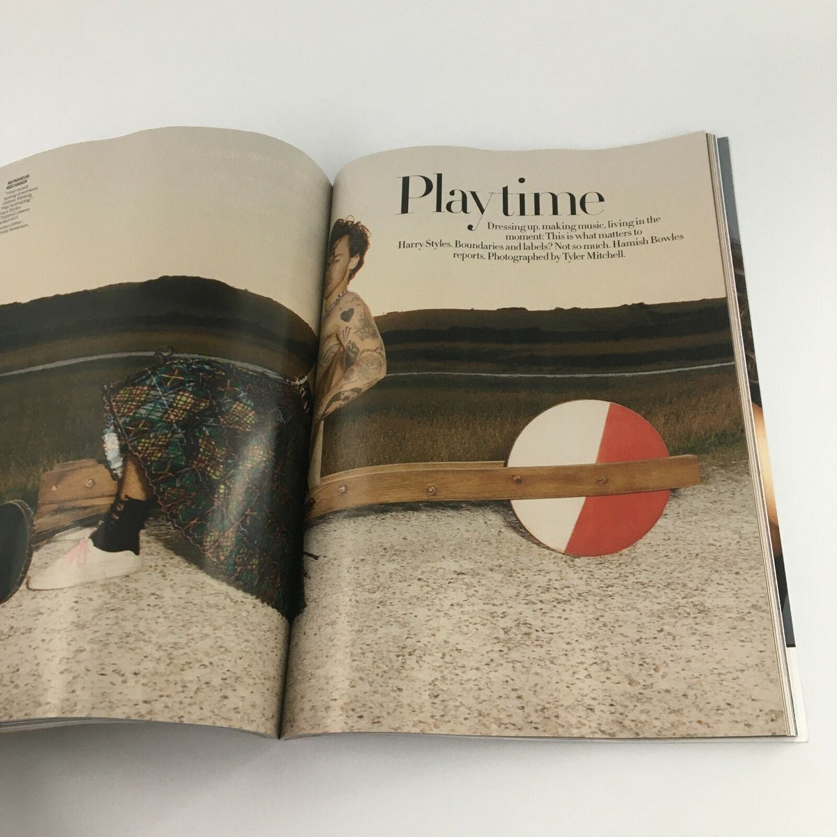 Inside spread of Vogue Magazine December 2020, highlighting the Playtime feature with Harry Styles, showcasing his artistic vision.