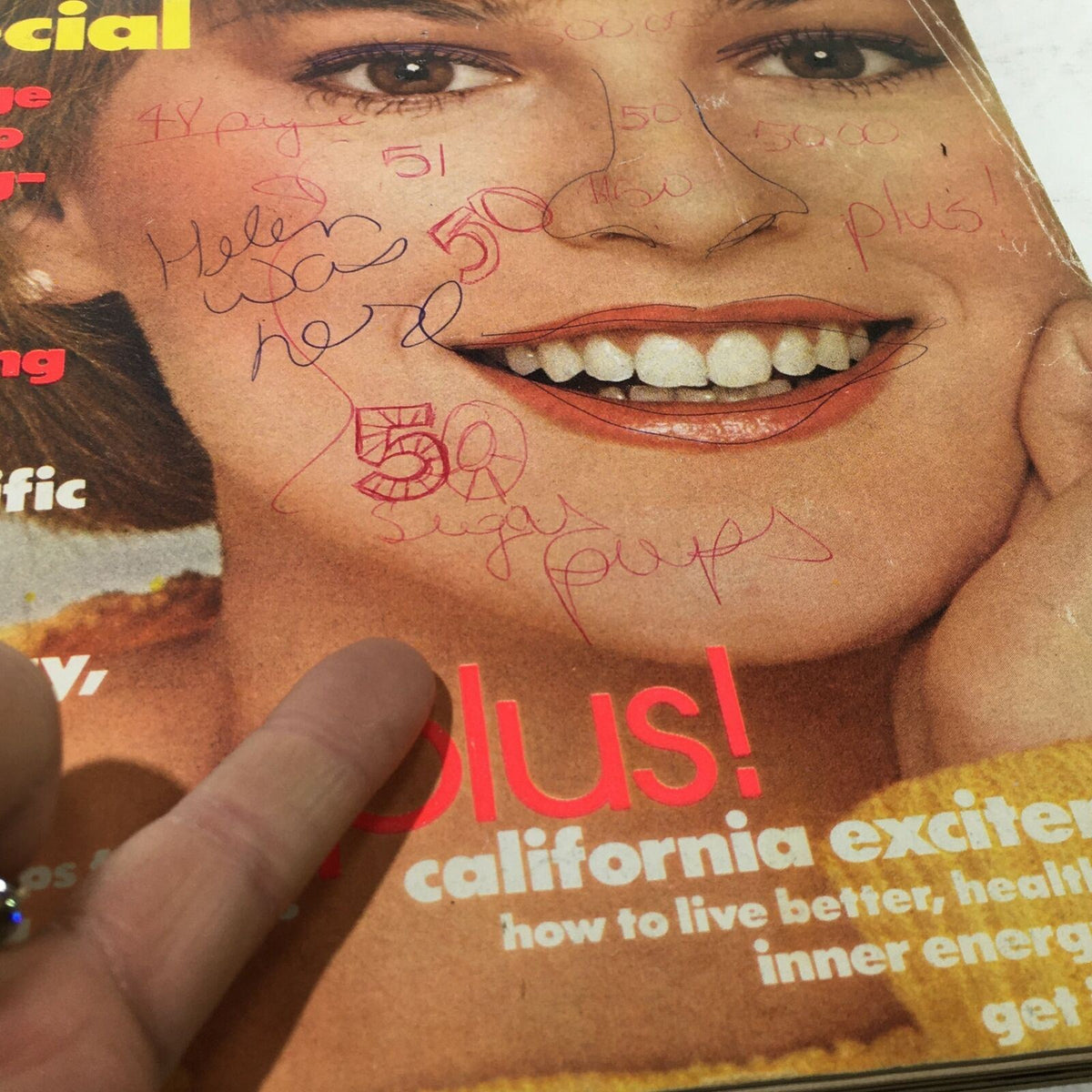 VTG Mademoiselle Magazine: April 1977 cover featuring a smiling model with handwritten notes and marks, highlighting its vintage charm and original newsstand condition.