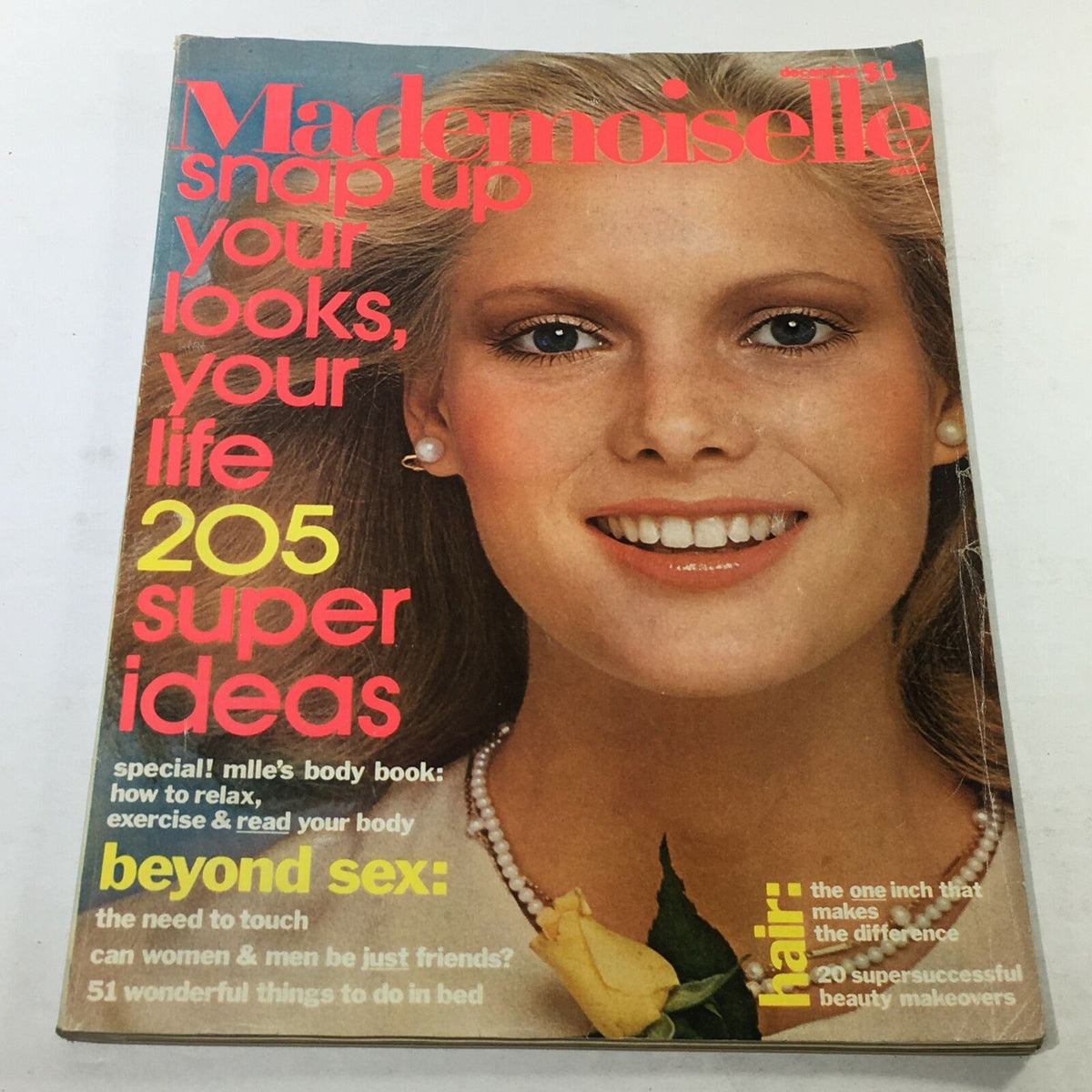 Mademoiselle Magazine December 1975 featuring Lisa Cooper on the cover with the headline 'snap up your looks, your life 205 super ideas'. The cover highlights fashion and lifestyle tips from the 1970s.
