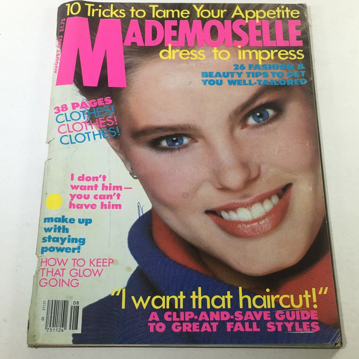 Cover of VTG Mademoiselle Magazine: August 1983 featuring a model with bright blue eyes, smiling, in a stylish sweater. The bold title 'Mademoiselle' is prominently displayed along with enticing fashion tips and a mention of 'I want that haircut!'. This vintage magazine is labeled as having no label or newsstand. Perfect for collectors and fashion enthusiasts.