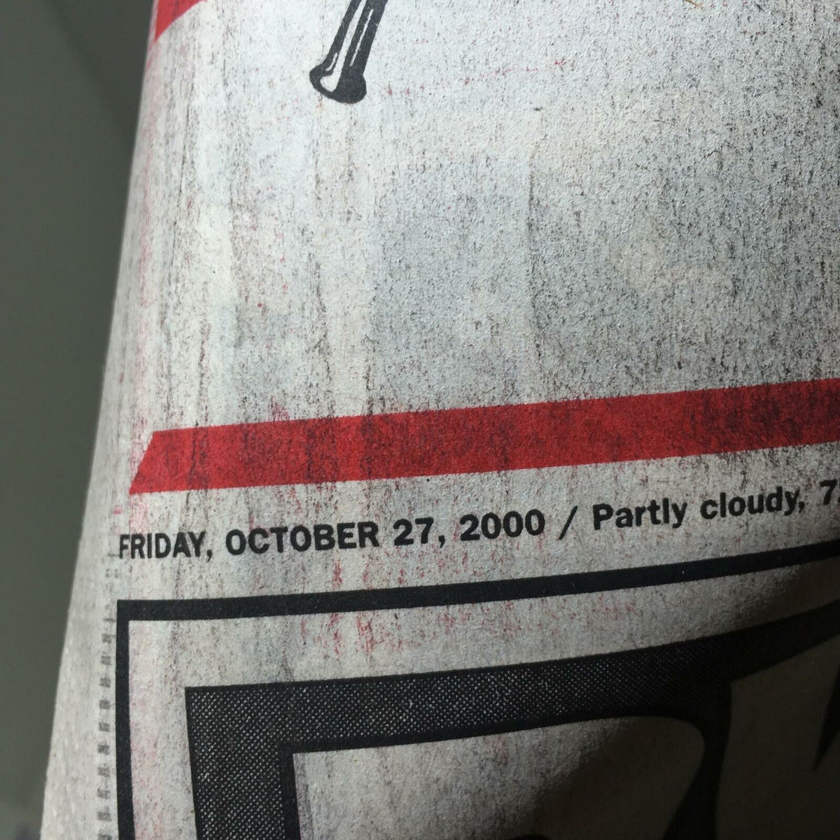 Date detail from the New York Post, advertising the publication date, Friday, October 27, 2000, with a weather report of partly cloudy.