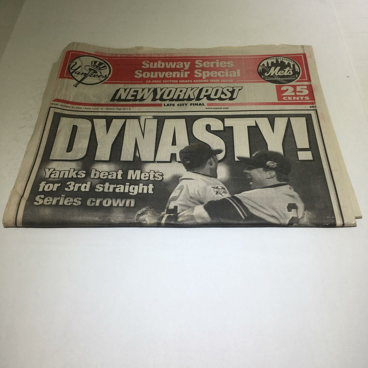 Folded New York Post from October 27, 2000, titled 'DYNASTY!', featuring a report on the Yankees beating the Mets for their third consecutive series crown.