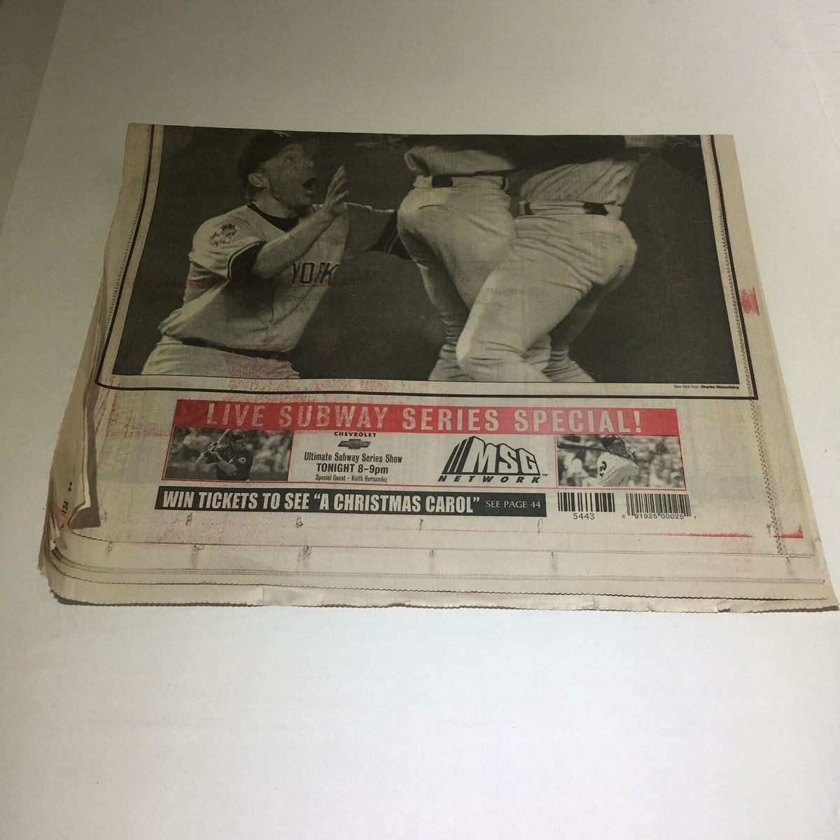 Image of the New York Post newspaper from October 27, 2000, highlighting the Subway Series Special, featuring Yankees celebrating a significant win over the Mets for their third consecutive championship.