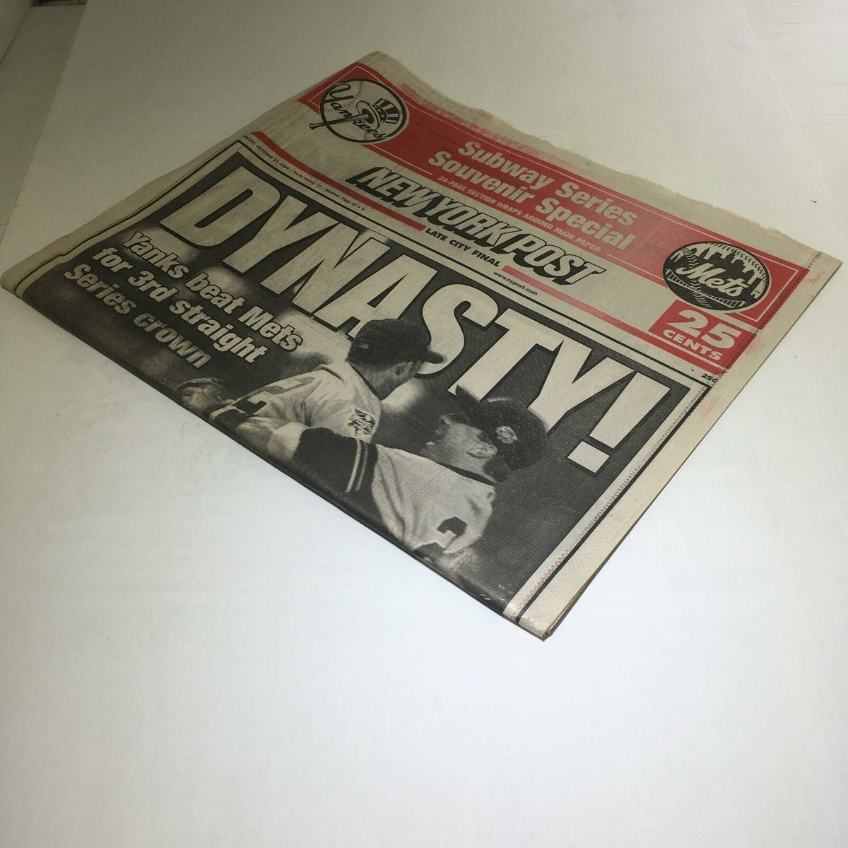 Cover of the New York Post newspaper dated October 27, 2000, with the headline 'DYNASTY! Yanks Beat Mets For 3rd Straight Series Crown', commemorating the Yankees' victory.