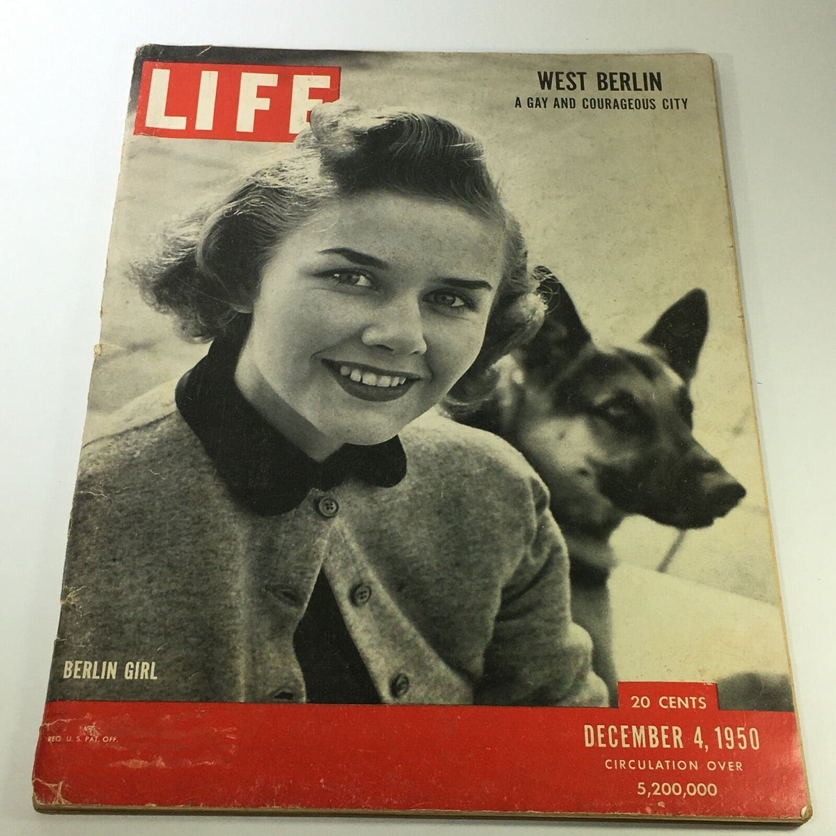 Life Magazine cover from December 4, 1950 featuring a smiling girl from Berlin with a German shepherd dog, highlighting the theme 'West Berlin: A Gay & Courageous City'.
