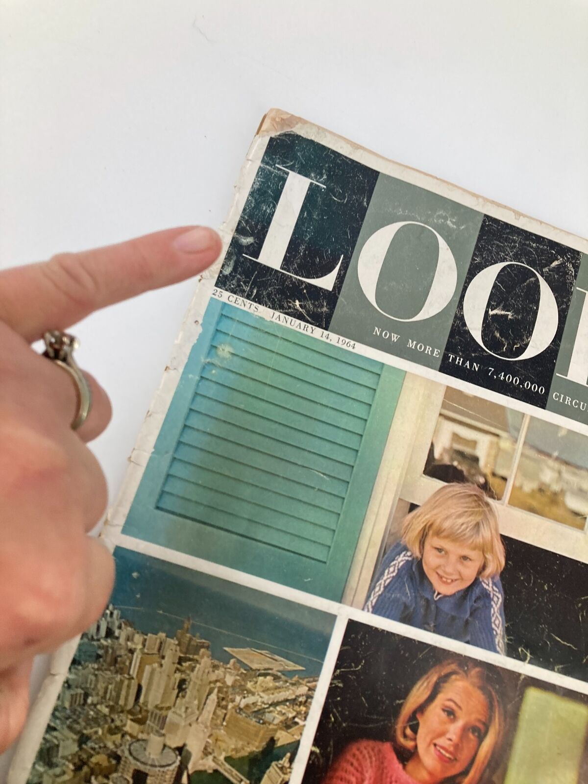 Close-up view of the VTG Look Magazine from January 14, 1964, highlighting the title and cover details, which include urban imagery and a nostalgic design.