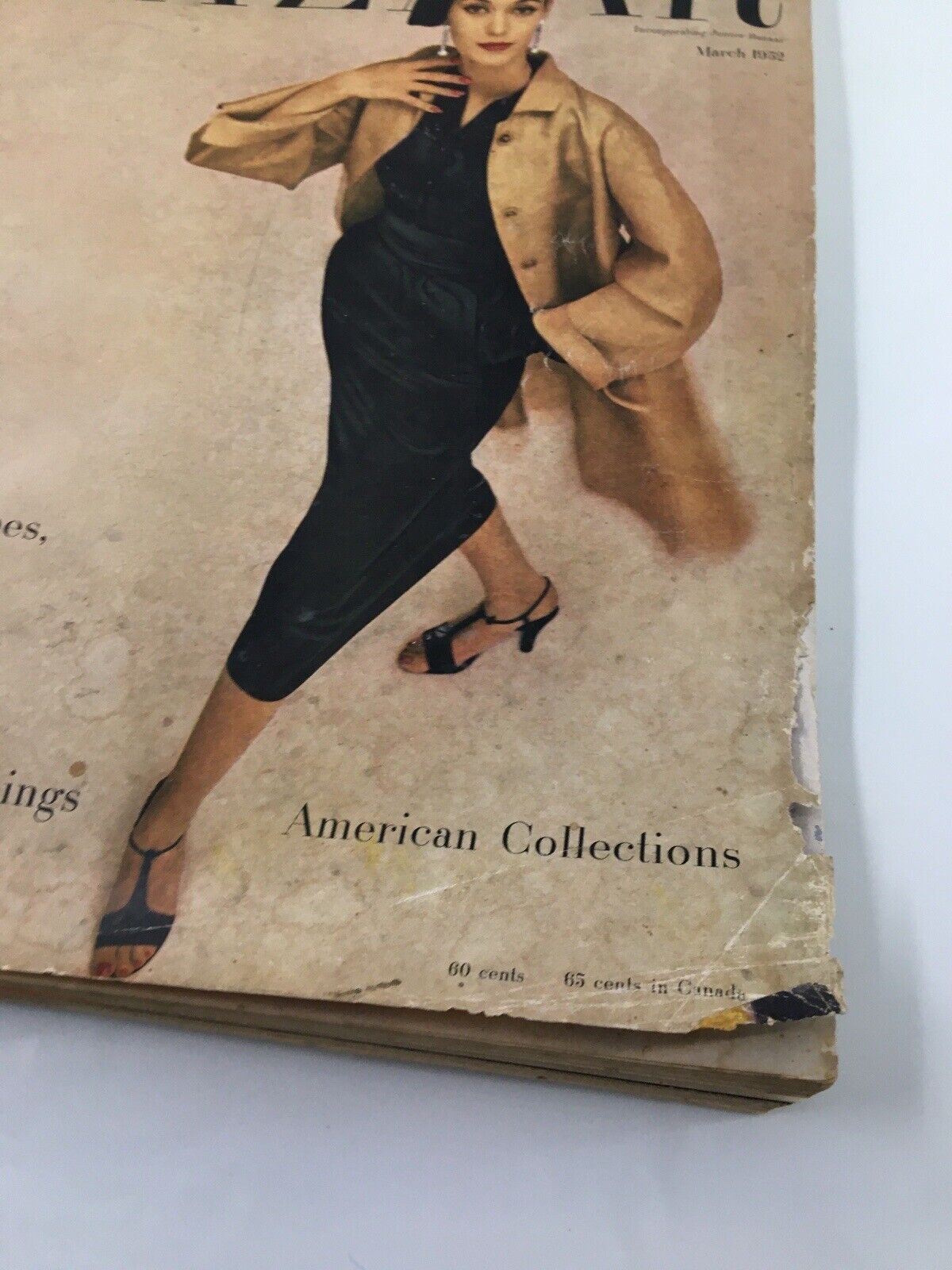 Image capturing the bottom section of the cover of Harper's Bazaar March 1952 Fashion edition, featuring the text 'American Collections'.