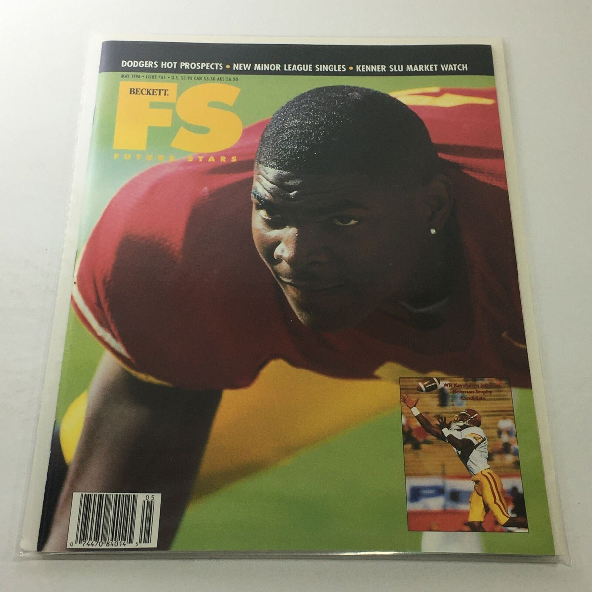 Cover of Beckett Future Stars: May 1996 Issue #61 featuring Keyshawn Johnson. The magazine showcases hot prospects and minor league singles, highlighting the player's dynamic pose and colorful design.