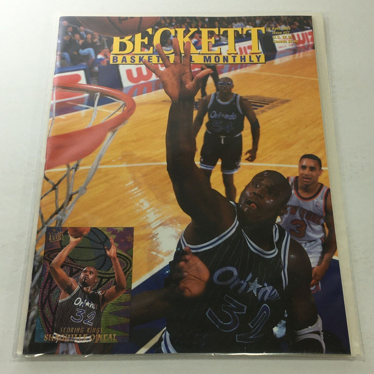 Beckett Basketball Monthly April 1995 Issue #57 featuring Shaquille O'Neal making a slam dunk on the cover with vibrant basketball action background.