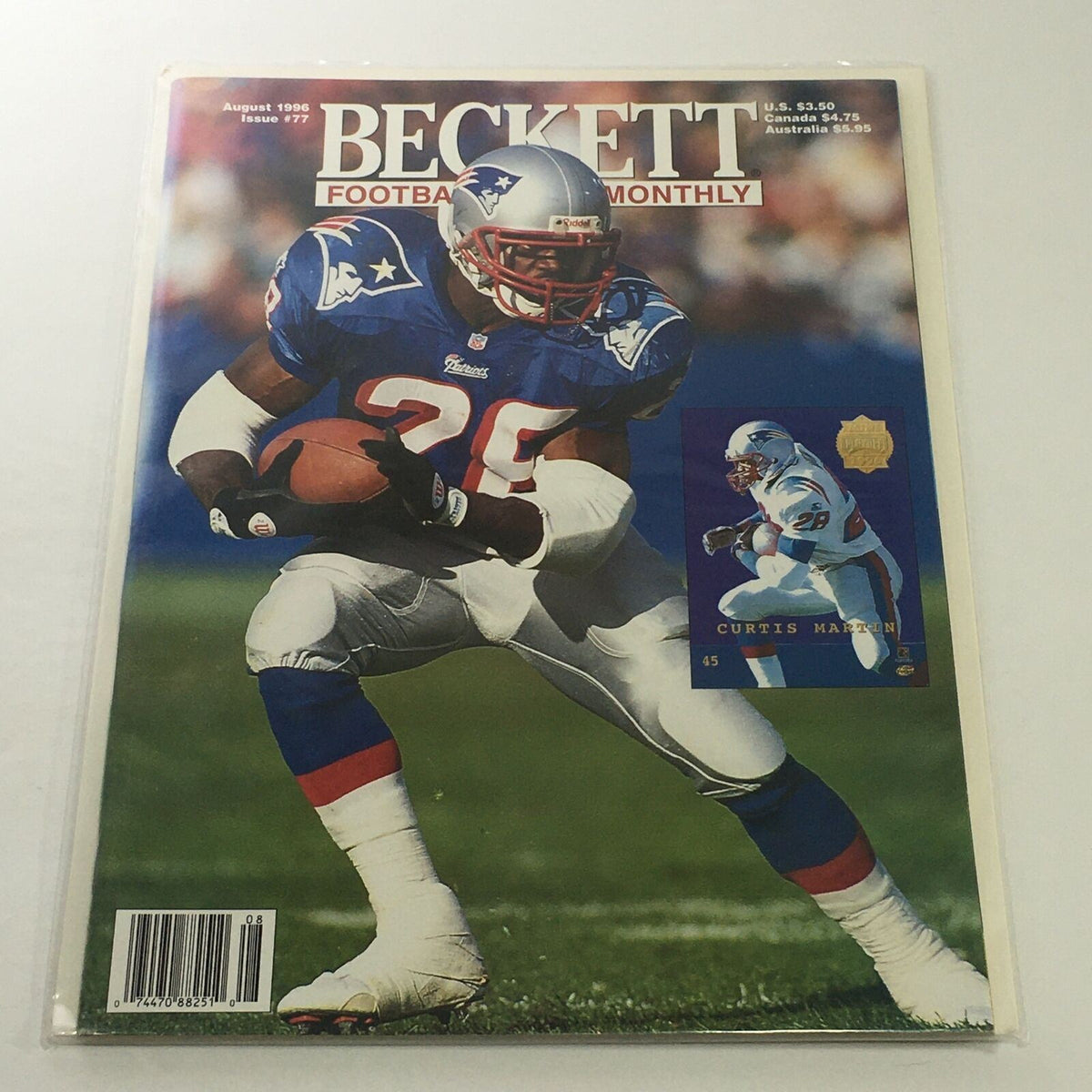 Beckett Football Card Monthly: August 1996 Issue #77 featuring Curtis Martin on the cover, showcasing him in a blue and white football uniform, with an action shot and a card image accompanying the magazine.