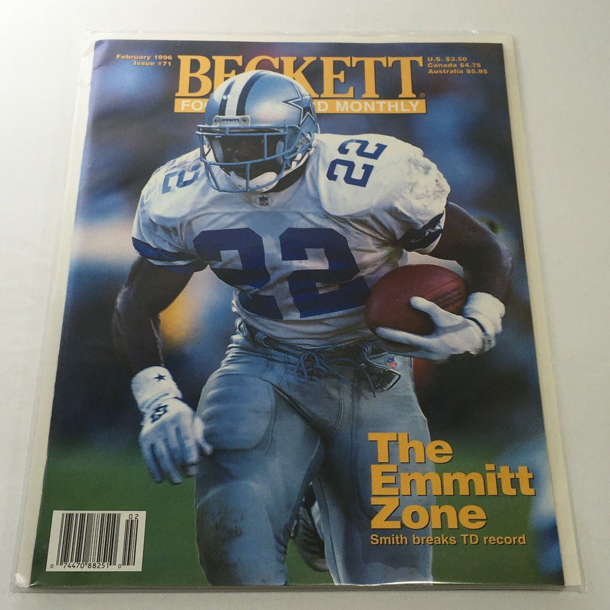 Beckett Football Card Monthly: February 1996 Issue #71 featuring Emmitt Smith on the cover, showcasing the headline 'The Emmitt Zone' along with a dynamic image of Smith wearing jersey number 22.