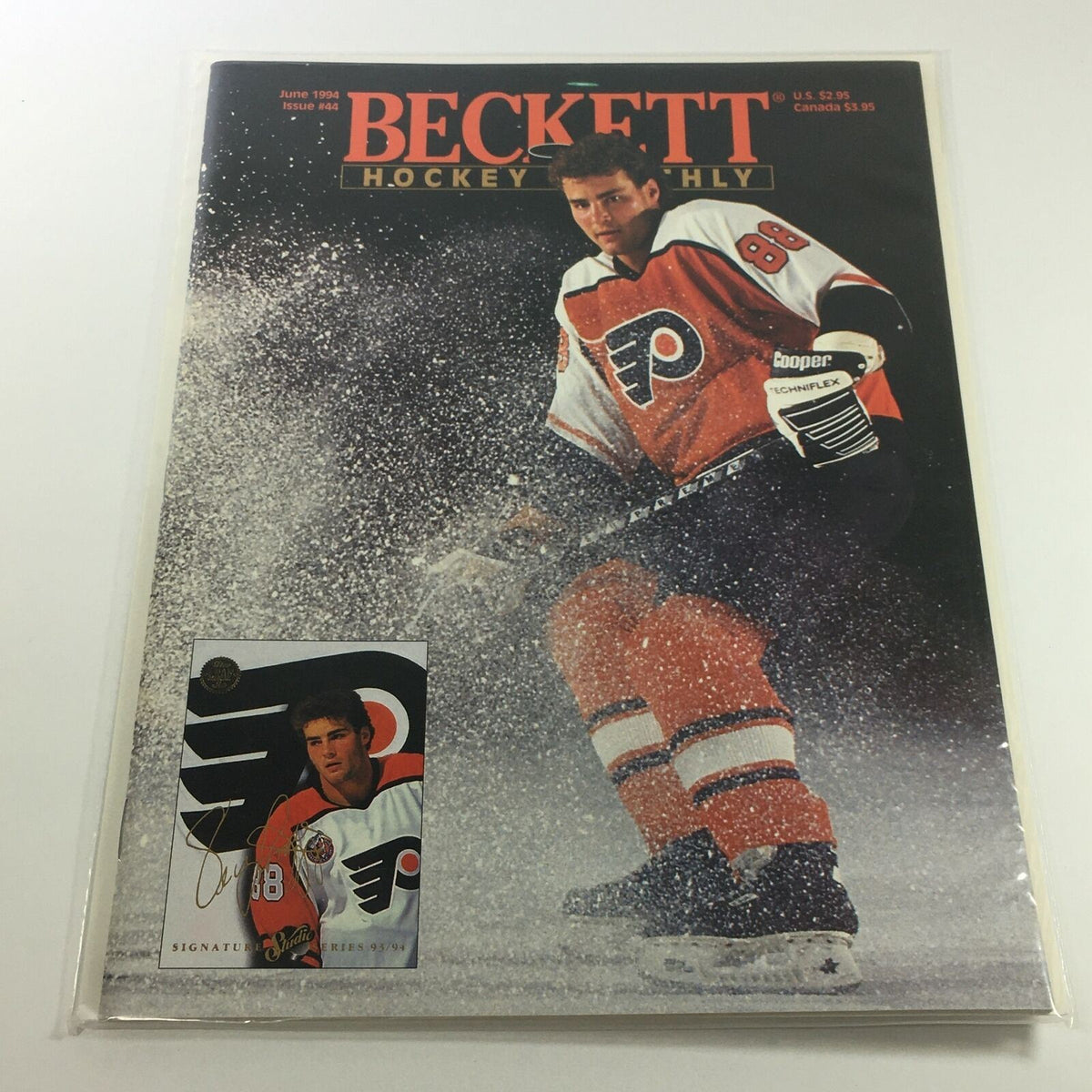 Beckett Hockey Monthly: June 1994 Issue #44 featuring a hockey player in a Philadelphia Flyers uniform, showcasing excellent condition with a signature card included.