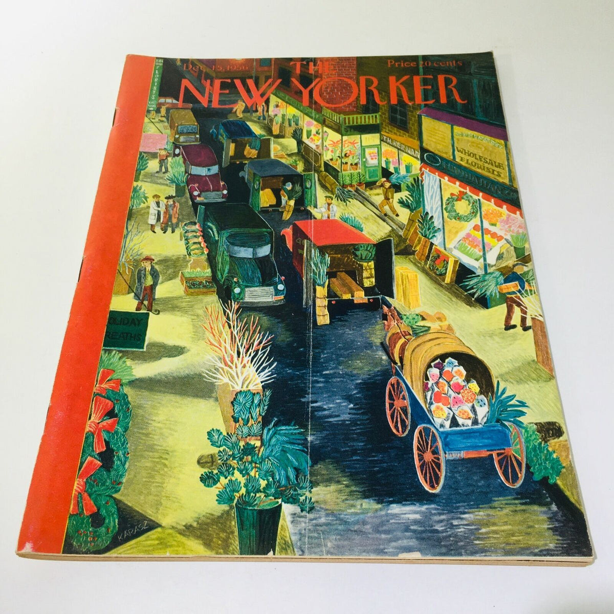 The New Yorker Magazine December 15, 1956 Full Theme Cover by Ilonka Karasz featuring vibrant street scene with vintage cars, holiday decorations, and bustling market atmosphere. A collectible piece reflecting mid-20th century art and culture.