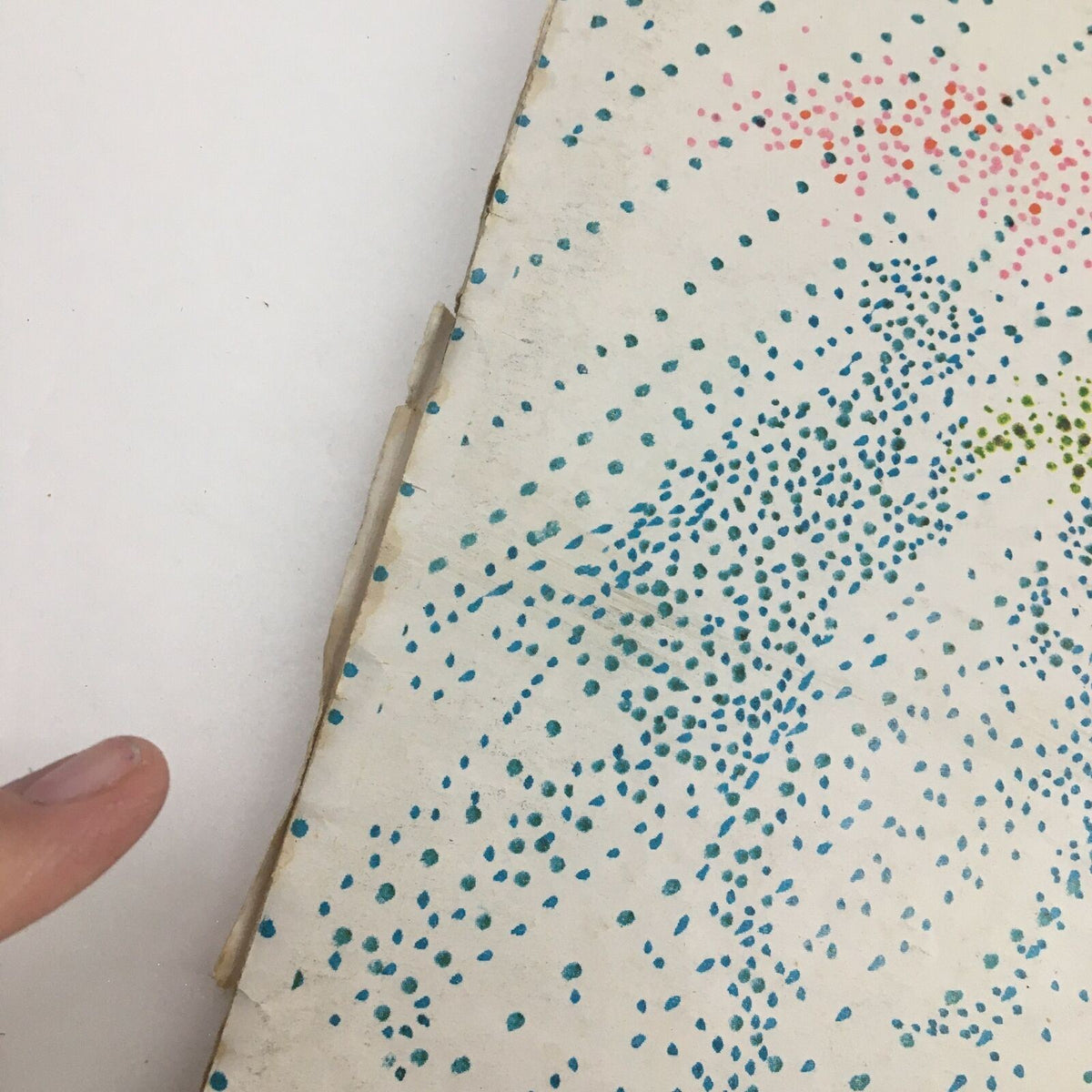 Close-up view of the spine of The New Yorker Magazine April 22, 1974, indicating signs of wear and the vintage quality of the issue.