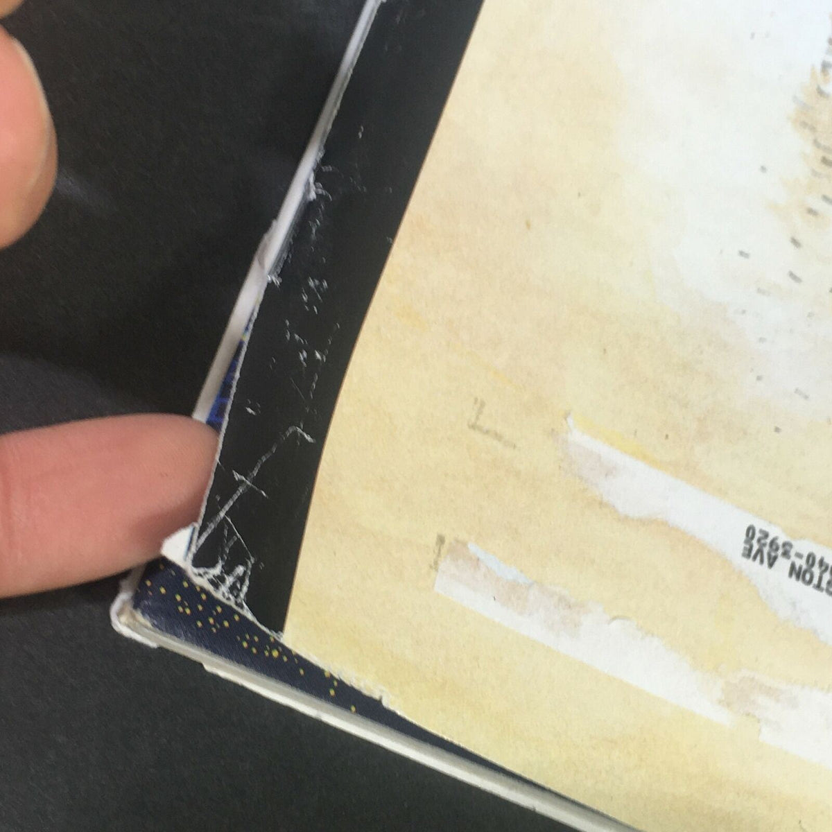 Side view of The New Yorker July 7 & 14, 2008 magazine showing minor wear and corner damage.