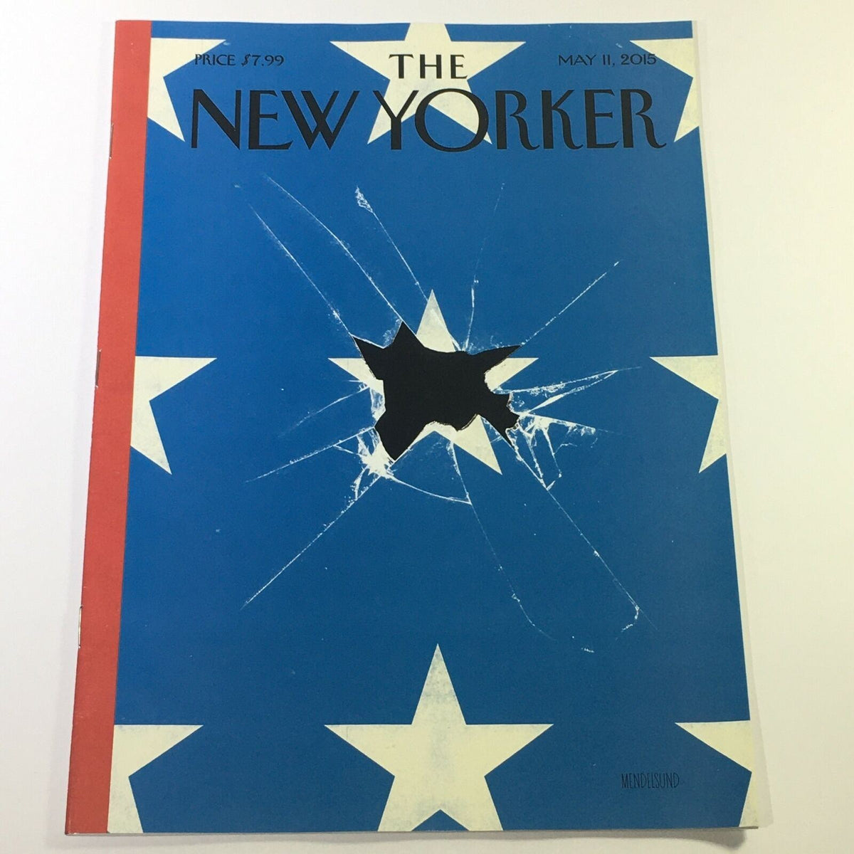 Cover of The New Yorker Magazine from May 11, 2015, featuring the artwork 'Shattered Star on Flag' by Peter Mendelsund, showcasing a blue background with a shattered star and white stars.