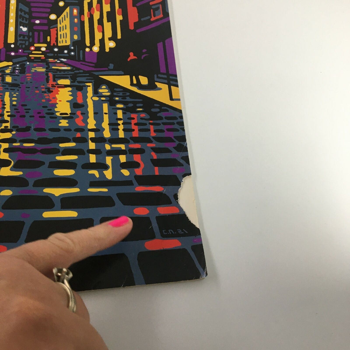 Close-up of the cover of The New Yorker magazine February 8, 2021, highlighting a tear in the corner, showcasing the artwork by Christoph Niemann.