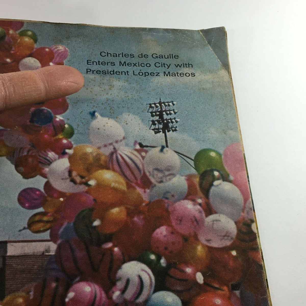Close-up view of the VTG Life Magazine March 27, 1964 cover featuring Charles de Gaulle and President López Mateos with colorful balloons in the background.