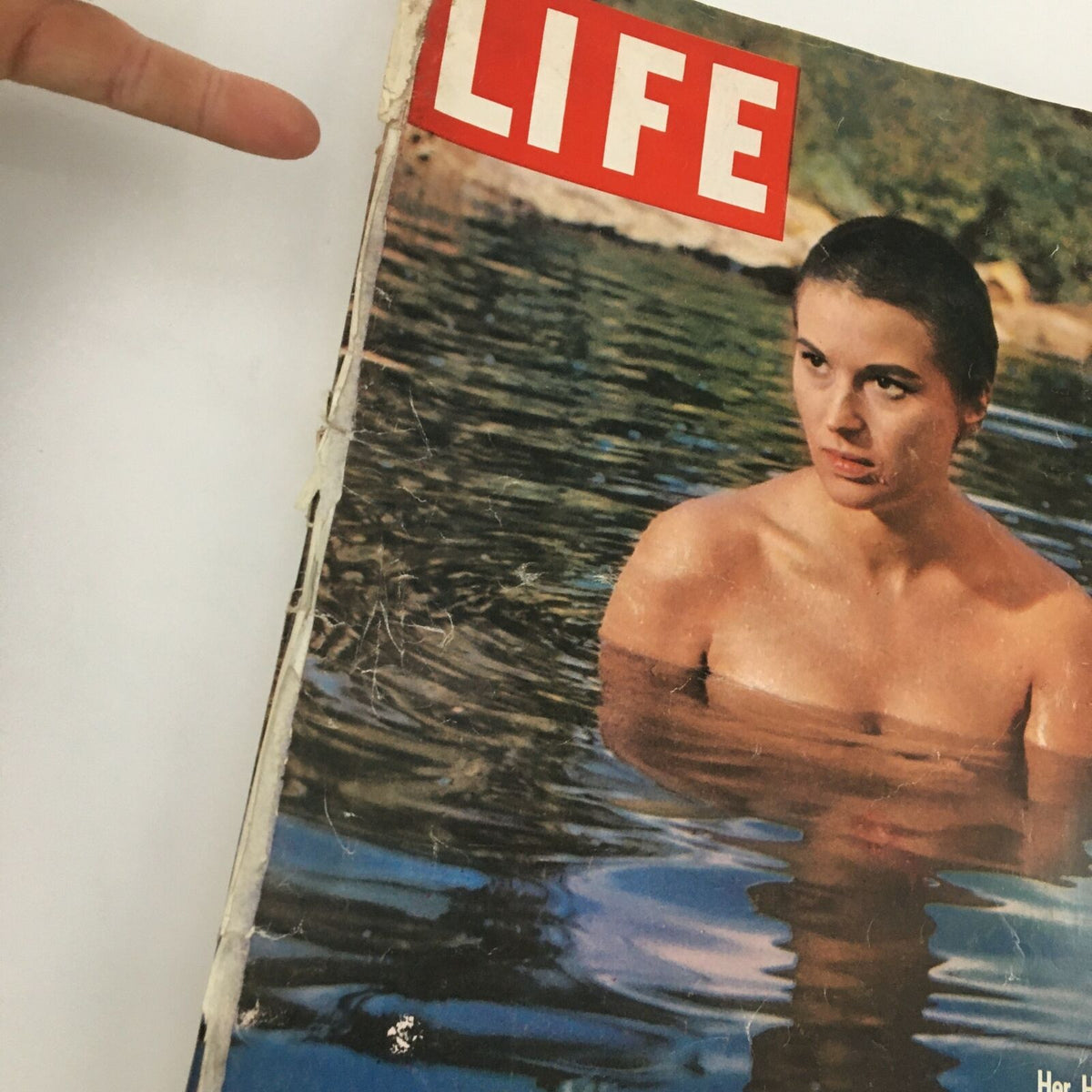 Close-up view of the cover of VTG Life Magazine April 11 1960, highlighting Italian actress Silvana Mangano, immersed in water, with vintage wear details.