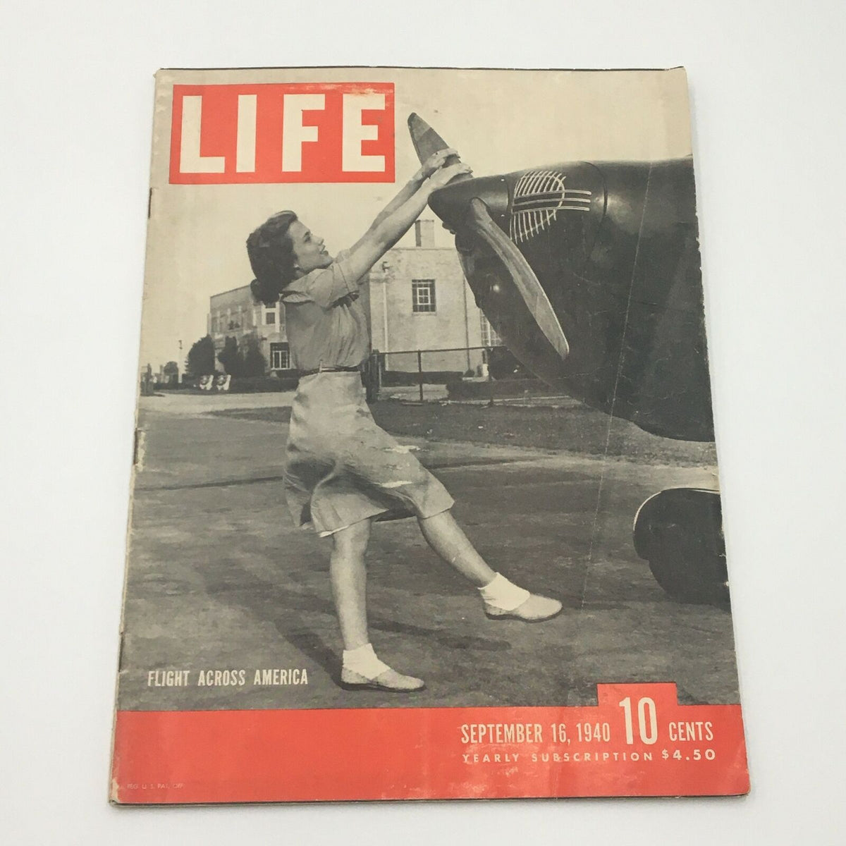Front cover of VTG Life Magazine September 16 1940 featuring a woman interacting with an airplane propeller, captioned 'Flight Across America' with a red and white design.