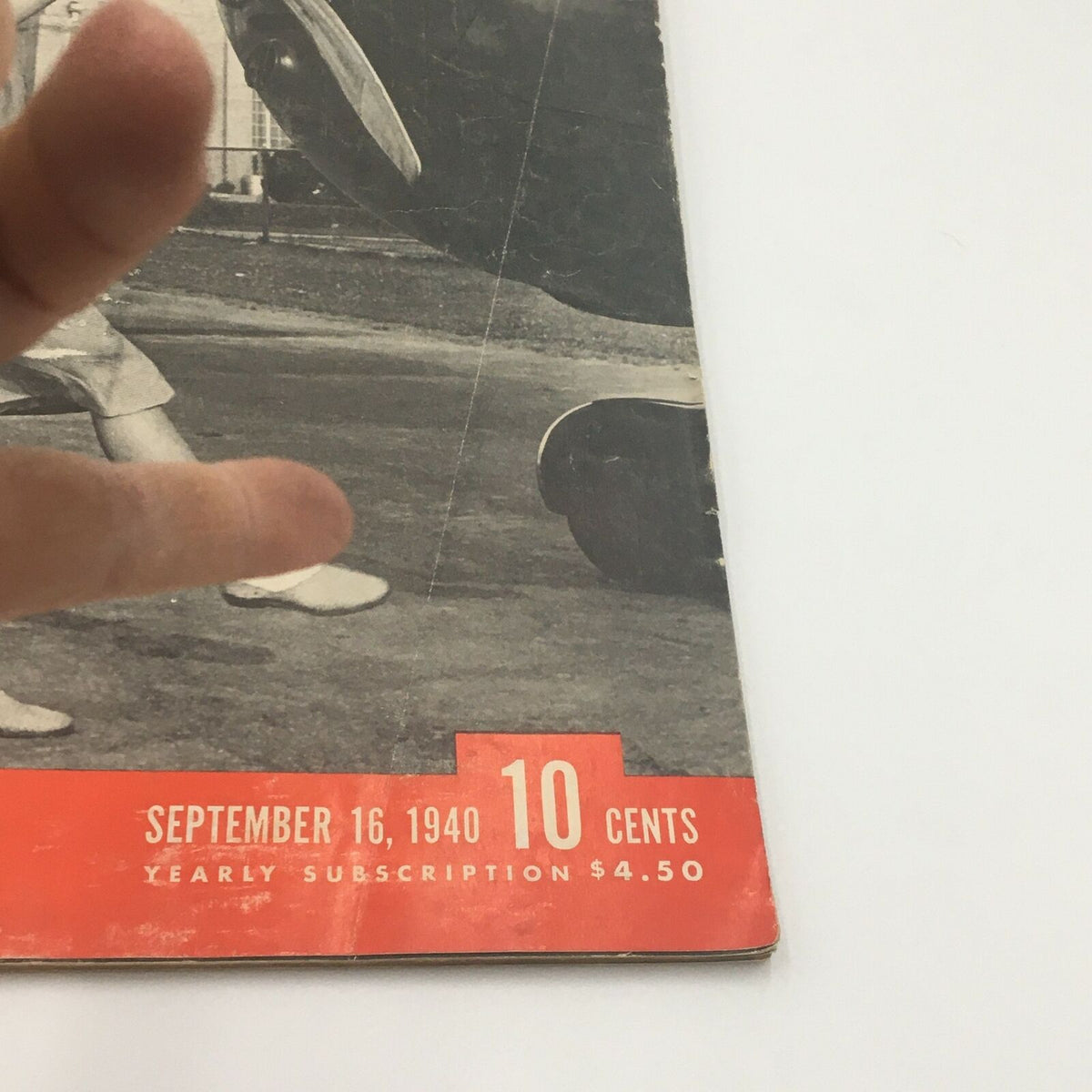 Close-up view of the front cover of VTG Life Magazine September 16 1940, highlighting the publication date and pricing information, along with the image of a woman near an airplane.