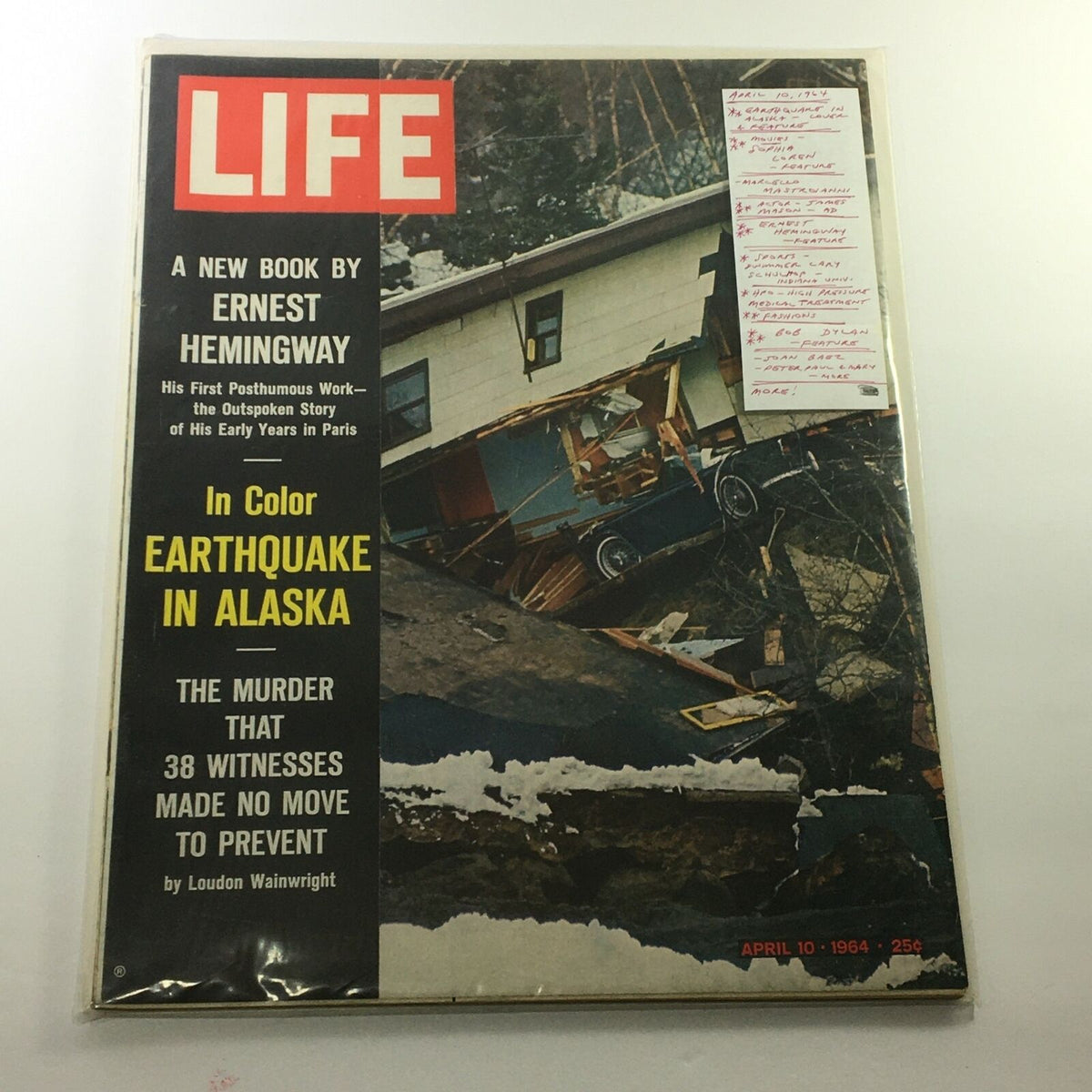 VTG Life Magazine April 10 1964 displayed in protective plastic, showcasing its cover with earthquake-related imagery and marked details from previous owners.