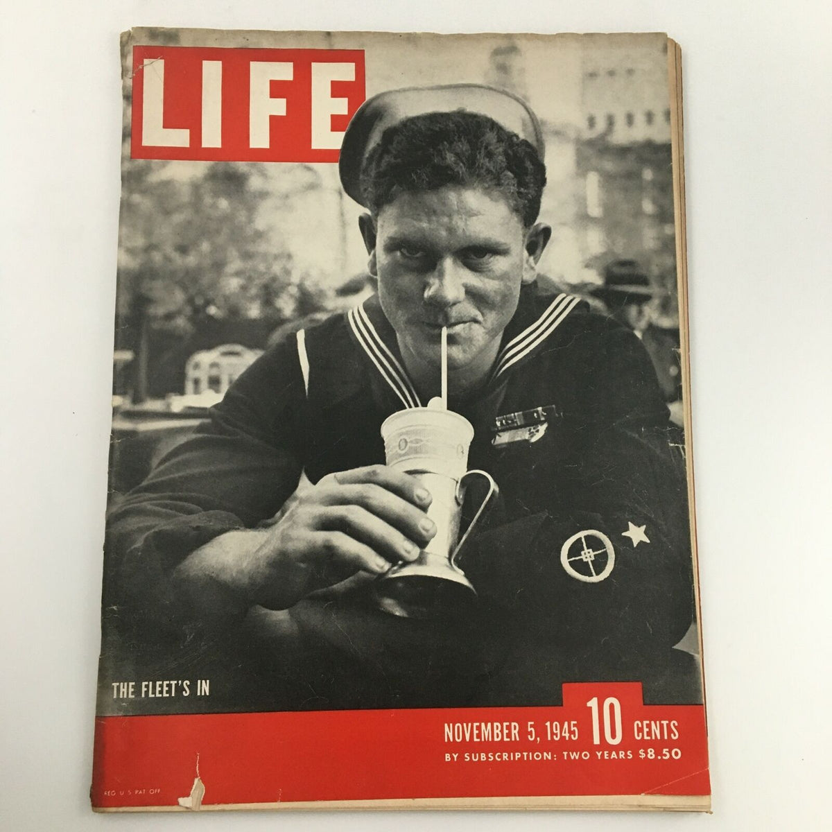 Vintage Life Magazine cover from November 5, 1945, featuring a sailor drinking a milkshake with the headline 'The Fleet's In,' showcasing post-World War II America.
