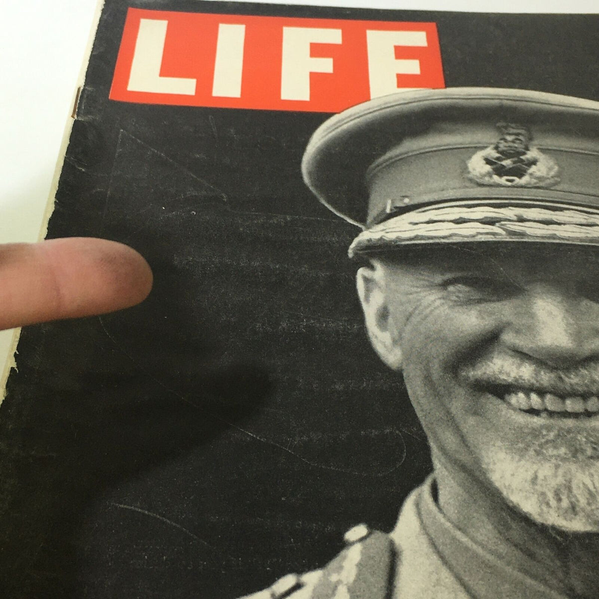 Close-up of the cover of VTG Life Magazine November 8, 1943 displaying the title 'LIFE' and an image of a smiling military figure.