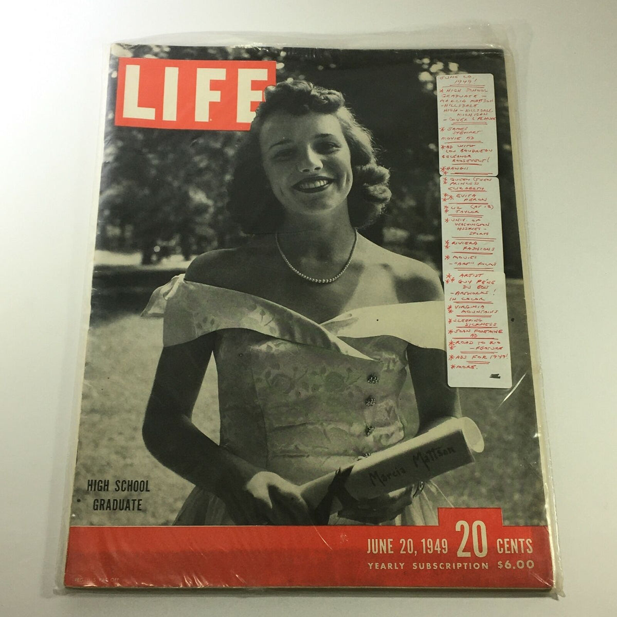 Life Magazine from June 20, 1949 with a protective cover, featuring Marcia Mattson as a high school graduate, highlighted by her smiling portrait in a vintage style.