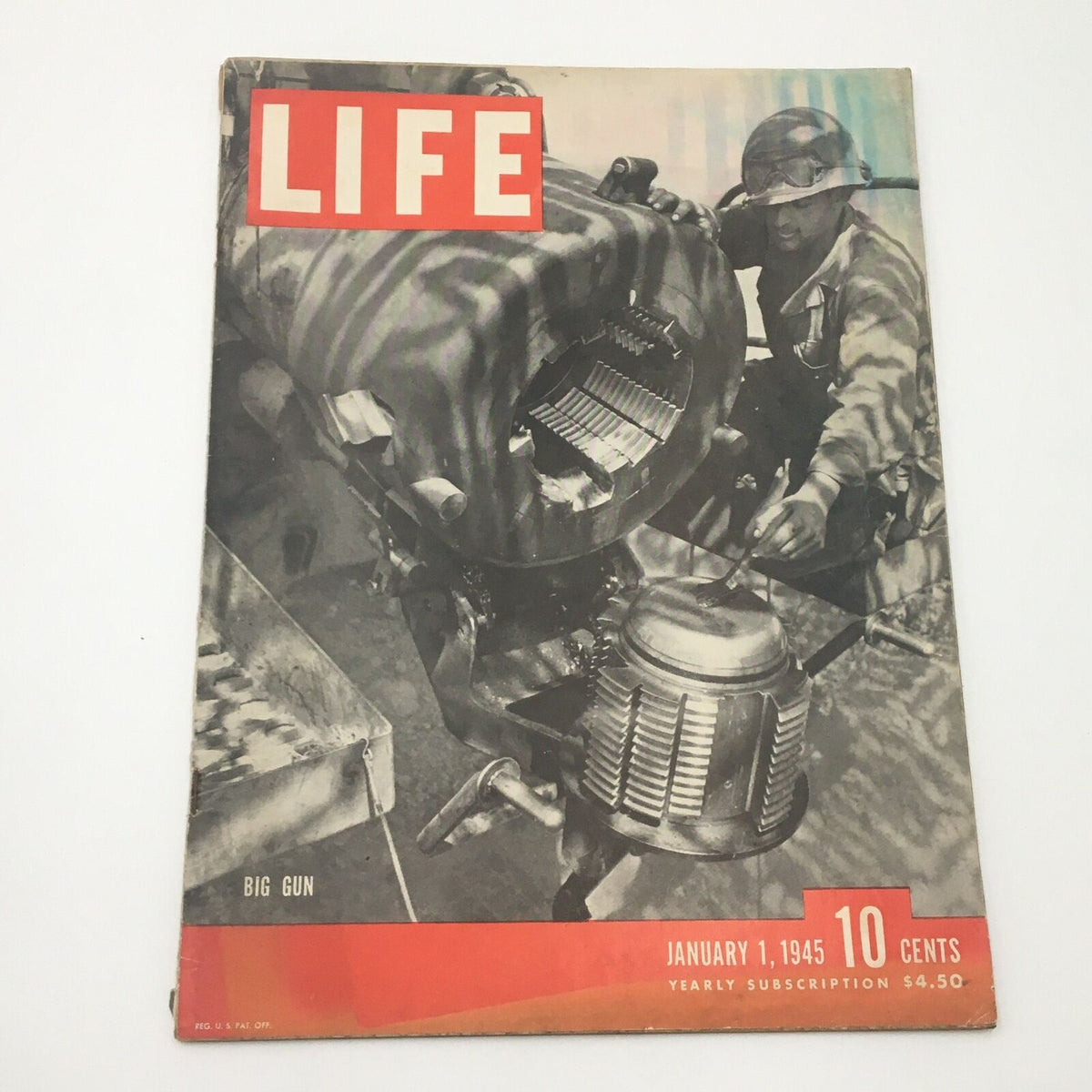 VTG Life Magazine January 1 1945 Big Guns Cover featuring wartime imagery, showcasing a soldier working on machinery, highlighting a significant historical artifact from World War II.