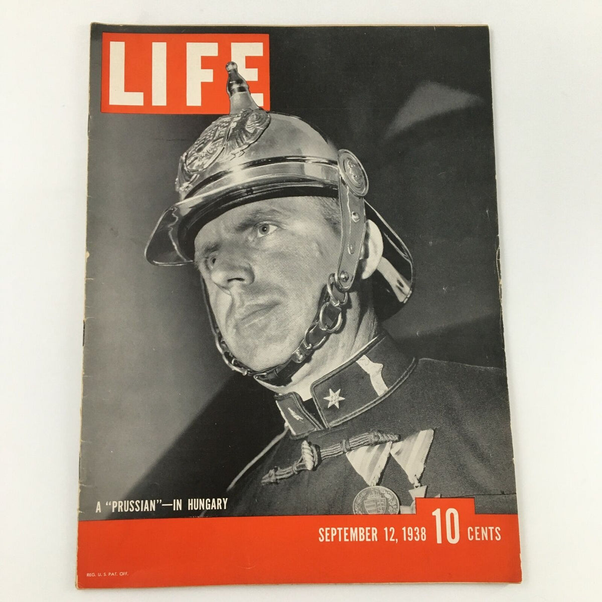 Vintage Life Magazine cover from September 12, 1938, featuring a soldier with a helmet, highlighting the article 'A Prussian in Hungary.'