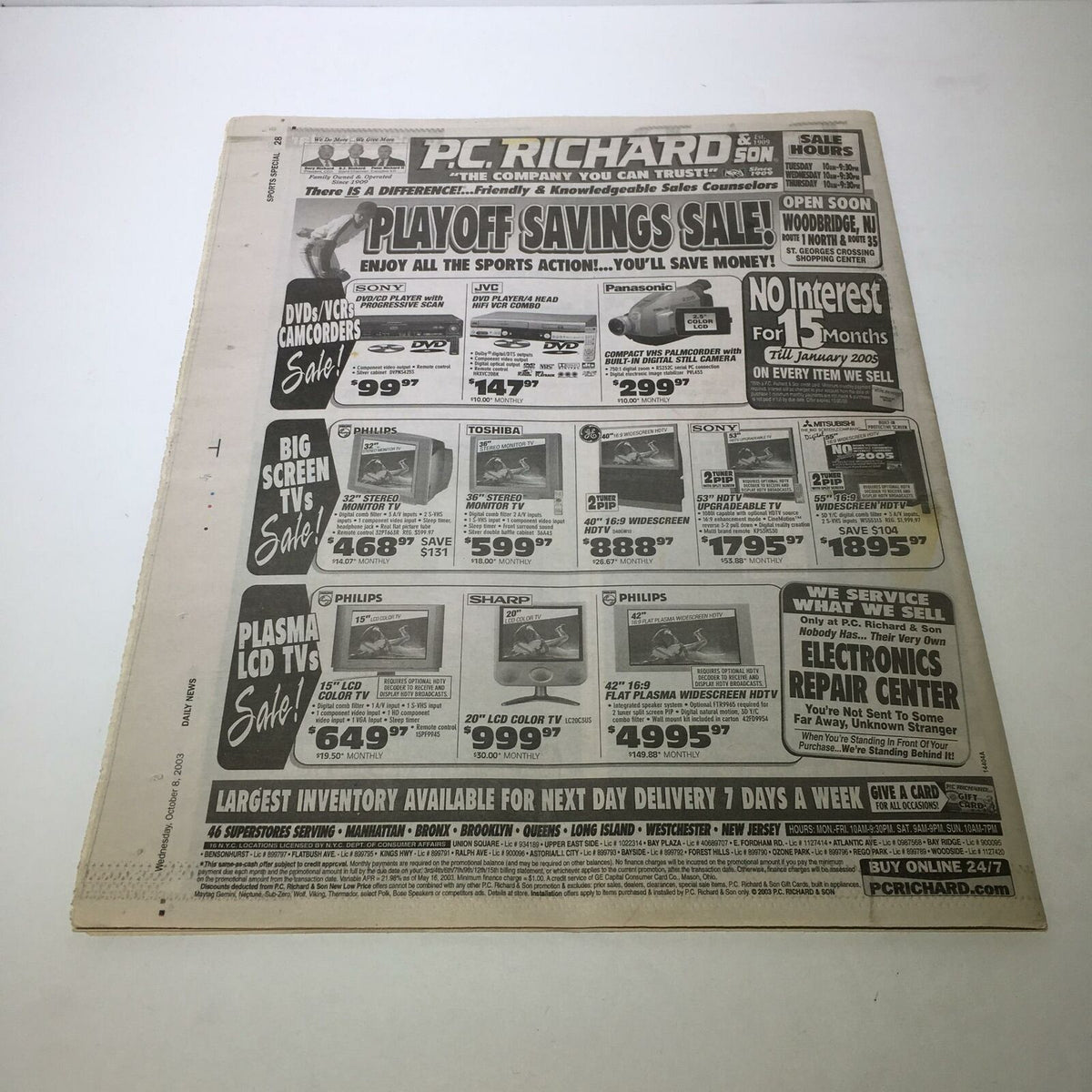 A newspaper advertisement featuring a 'Playoff Savings Sale' at PC Richard, promoting various electronics with prices and offers. Includes the title 'Sports Special Daily News: Oct 8 2003 Yankee Aces Ready 2 Deal Red Sox Out'.