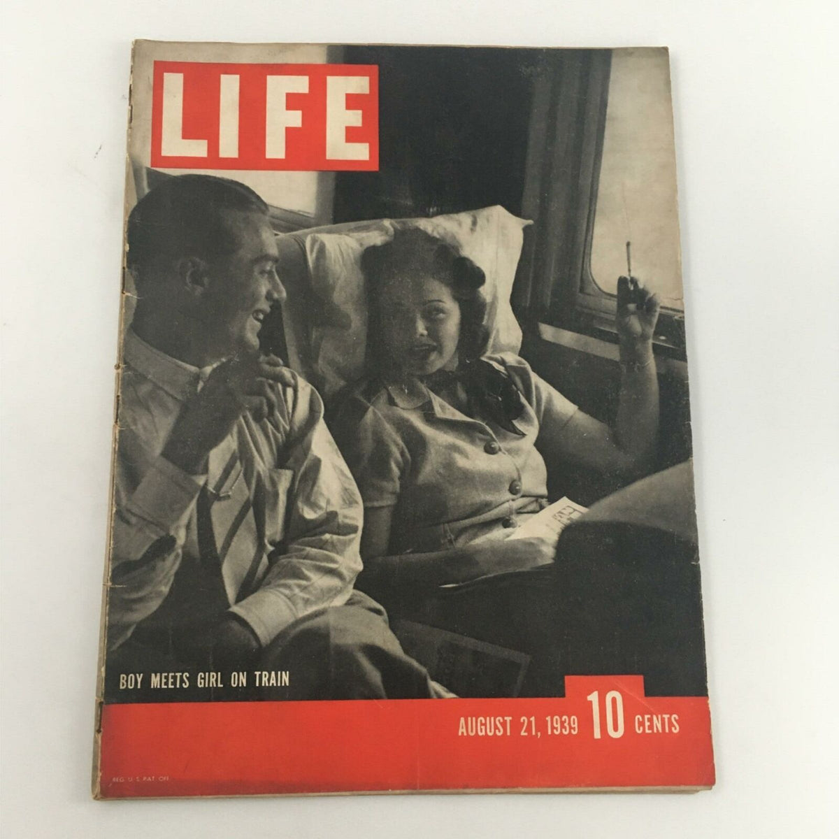 Vintage Life Magazine dated August 21, 1939, featuring a captivating cover photo of a couple on a train, titled 'Boy Meets Girl on Train', highlighting the magazine title prominently in red.