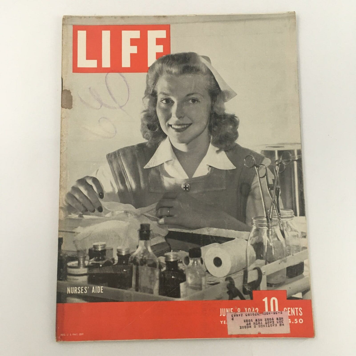Cover of VTG Life Magazine from June 8, 1942 featuring Nurses' Aide Lorraine Ames of Hillsborough, showcasing a nurse smiling with medical supplies.