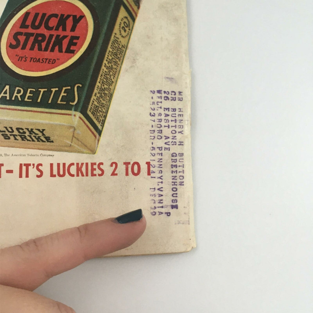 Detail of the back cover of VTG Life Magazine May 2, 1938 highlighting an addressed label and advertisement for Lucky Strike cigarettes, emphasizing its vintage characteristics.
