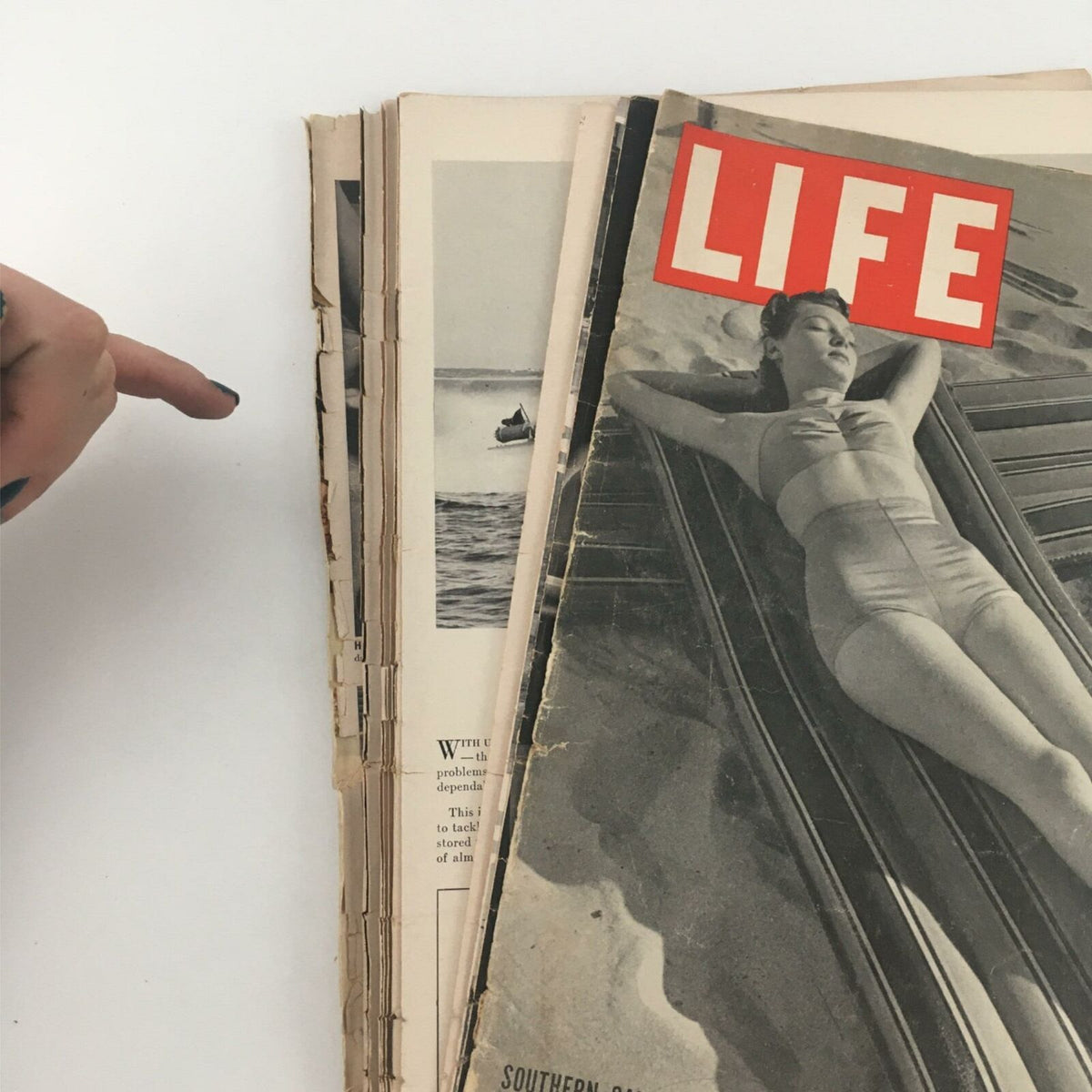 VTG Life Magazine January 13, 1941 Southern Sand Styles showing the magazine's spine with visible wear and the cover featuring a model relaxing by the beach, illustrating classic 1940s style.